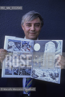 Venice, 1990. Italian cartoonist Milo Manara holding one of his comics / Venezia, 1990. Il disegnatore Milo Manara  con in mano uno dei suoi fumetti - ©Marcello Mencarini/Rosebud2