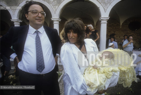 Venice, about 1985. Italian politician Gianni De Michelis and fashion stylist Fiorella Mancini at the baptism of her daughter / Venezia, 1985 circa. Il politico Gianni De Michelis con la stilista Fiorella Mancini al battesimo della figlia di lei - ©Marcello Mencarini/Rosebud2