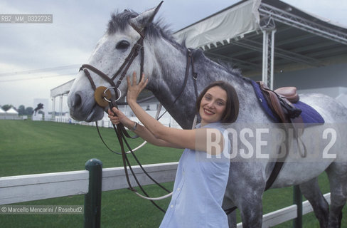 Modena, 1999. Luciano Pavarottis wife, Nicoletta Mantovani with a horse of Pavarotti stable / Modena, 1999. La moglie di Luciano Pavarotti, Nicoletta Mantovani con un cavallo della scuderia Pavarotti - ©Marcello Mencarini/Rosebud2