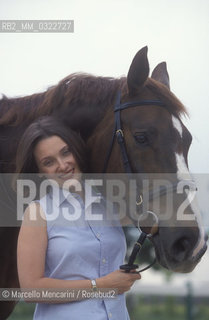 Modena, 1999. Luciano Pavarottis wife, Nicoletta Mantovani with a horse of Pavarotti stable / Modena, 1999. La moglie di Luciano Pavarotti, Nicoletta Mantovani con un cavallo della scuderia Pavarotti - ©Marcello Mencarini/Rosebud2