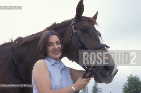 Modena, 1999. Luciano Pavarottis wife, Nicoletta Mantovani with a horse of Pavarotti stable / Modena, 1999. La moglie di Luciano Pavarotti, Nicoletta Mantovani con un cavallo della scuderia Pavarotti - ©Marcello Mencarini/Rosebud2