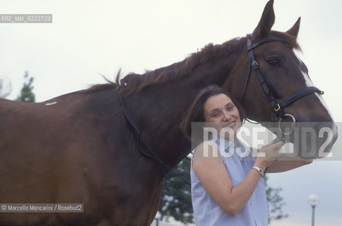 Modena, 1999. Luciano Pavarottis wife, Nicoletta Mantovani with a horse of Pavarotti stable / Modena, 1999. La moglie di Luciano Pavarotti, Nicoletta Mantovani con un cavallo della scuderia Pavarotti - ©Marcello Mencarini/Rosebud2