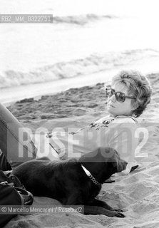 Ostia (Rome), Castelporziano beach, 1979. Italian writer Dacia Maraini at the First Festival of the Poets / Ostia (Roma), spiaggia di Castelporziano. La scrittrice Dacia Maraini al Primo Festival dei poeti - ©Marcello Mencarini/Rosebud2