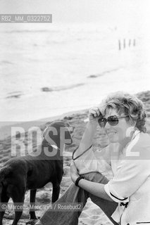 Ostia (Rome), Castelporziano beach, 1979. Italian writer Dacia Maraini at the First Festival of the Poets / Ostia (Roma), spiaggia di Castelporziano. La scrittrice Dacia Maraini al Primo Festival dei poeti - ©Marcello Mencarini/Rosebud2