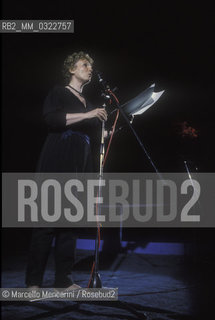 Rome, Villa Borghese, 1985. Italian writer Dacia Maraini at the International Festival of the Poets reading on stage / Roma, Villa Borghese, 1985. La scrittrice Dacia Maraini al Festival internazionale dei poeti mentre legge sul palco - ©Marcello Mencarini/Rosebud2