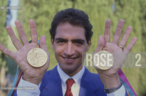 Rome, 1984. Italian pentathlete Daniele Masalab showing the two golden medals for both individual and team competitions, won at the Los Angeles Olympic Games / Roma, 1984. Il pentatleta Daniele Masala mostra le due medaglie doro, individuale e a squadre, vinte alle Olimpiadi di Los Angeles - ©Marcello Mencarini/Rosebud2