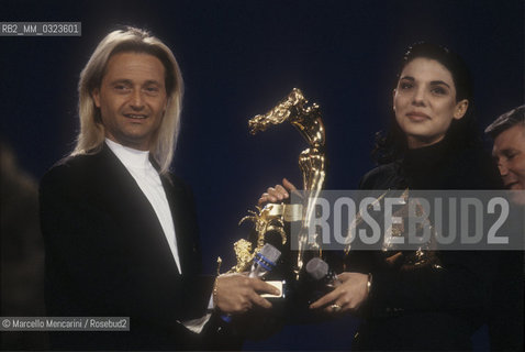 Sanremo Music Festival 1990. Italian pop singers Amedeo Minghi and Mietta, winners of the Festival for the song Vattene Amore / Festival di Sanremo 1990. I cantanti Amedeo Minghi con Mietta, vincitori del Festival con la canzone Vattene amore - ©Marcello Mencarini/Rosebud2