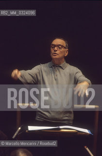 Rome, Pius XII Auditorium, 7-11-1998. Italian composer Ennio Morricone conducting a rehearsal / Roma, Auditorium Pio XII, 7-11-1998. Il compositore Ennio Morricone mentre dirige una prova - ©Marcello Mencarini/Rosebud2