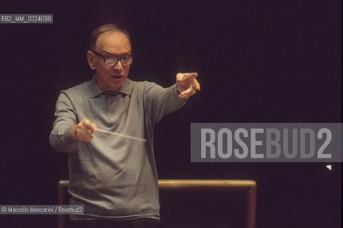 Rome, Pius XII Auditorium, 7-11-1998. Italian composer Ennio Morricone conducting a rehearsal / Roma, Auditorium Pio XII, 7-11-1998. Il compositore Ennio Morricone mentre dirige una prova - ©Marcello Mencarini/Rosebud2