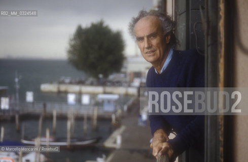 Venice, 1988. Italian composer Luigi Nono at a window of his house / Venezia, 1988. Il compositore Luigi Nono affacciato a una finestra della sua casa - ©Marcello Mencarini/Rosebud2