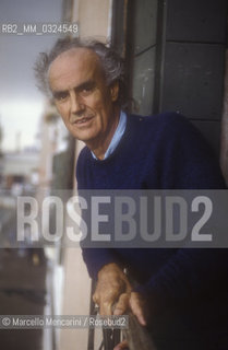 Venice, 1988. Italian composer Luigi Nono at a window of his house / Venezia, 1988. Il compositore Luigi Nono affacciato a una finestra della sua casa - ©Marcello Mencarini/Rosebud2