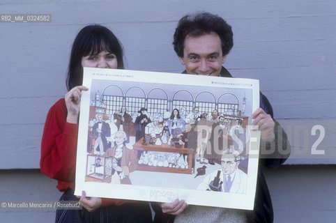 Lucca, 1984. Italian cartoonists Luca Novelli and Cinzia Ghigliano showing one of his drawing / Lucca, 1984. I disegnatori di fumetti Luca Novelli e Cinzia Ghigliano mostrano una delle loro illustrazioni - ©Marcello Mencarini/Rosebud2