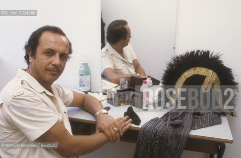 Pesaro, Rossini Opera Festival 1984. Italian opera singer baritone Leo Nucci in his dressing room before performing in Il viaggio a Reims (The Jorney to Reims) by Gioacchino Rossini / Pesaro, Rossini Opera Festival 1984. Il cantante lirico Leo Nucci nel suo camerino prima di cantare in Il viaggio a Reims di Gioacchino Rossini - ©Marcello Mencarini/Rosebud2