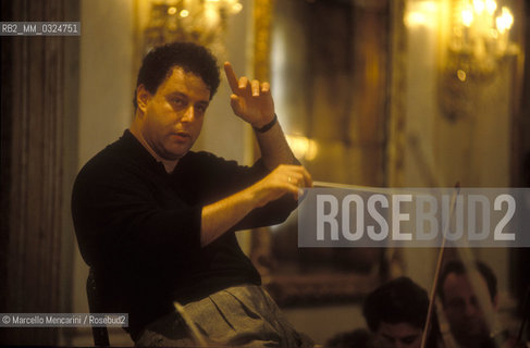 Venice, La Fenice Theater, 1991. Israeli conductor Daniel Oren during a rehearsal in the Apollonian Halls / Venezia, Teatro La Fenice, 1991. Il direttore dorchestra Daniel Oren durante una prova nelle Sale Apollinee - ©Marcello Mencarini/Rosebud2