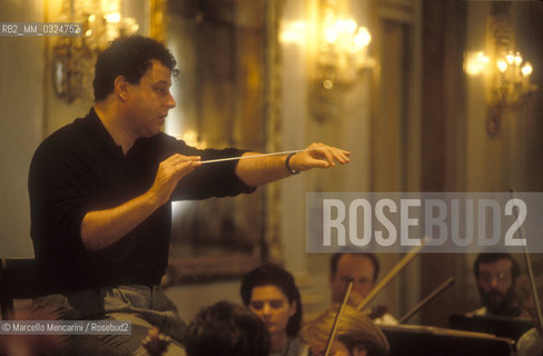 Venice, La Fenice Theater, 1991. Israeli conductor Daniel Oren during a rehearsal in the Apollonian Halls / Venezia, Teatro La Fenice, 1991. Il direttore dorchestra Daniel Oren durante una prova nelle Sale Apollinee - ©Marcello Mencarini/Rosebud2