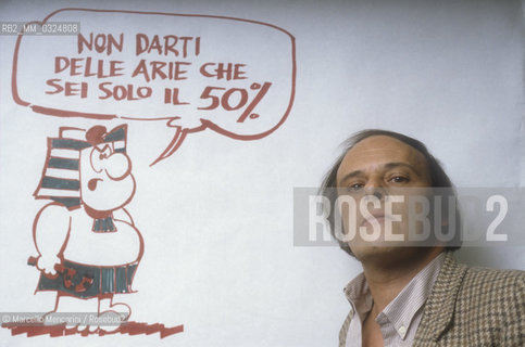 Lucca, 1986. Italian cartoonist Agostino Origone posing next to a character of his comic strip Nilus / Lucca, 1986. Il disegnatore di fumetti Agostino Origone mentre posa accanto a un personaggio della striscia Nilus - ©Marcello Mencarini/Rosebud2