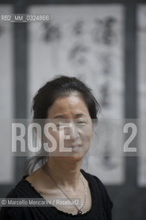 Festival of Literatures, Rome 2012. Japanese-American writer Julie Otsuka in front of some works by Chinese master calligrapher Xiao Yunru shown at Casa delle Letterature / Festival Letterature, Roma 2012. La scrittrice Julie Otsuka davanti ad alcune opere del calligrafo cinese Xiao Yunru esposte nella Casa delle Letterature - ©Marcello Mencarini/Rosebud2