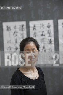 Festival of Literatures, Rome 2012. Japanese-American writer Julie Otsuka in front of some works by Chinese master calligrapher Xiao Yunru shown at Casa delle Letterature / Festival Letterature, Roma 2012. La scrittrice Julie Otsuka davanti ad alcune opere del calligrafo cinese Xiao Yunru esposte nella Casa delle Letterature - ©Marcello Mencarini/Rosebud2