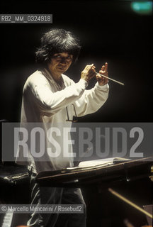 Florence, 1995. Japanese conductor Seiji Ozawa performing a rehearsal with Orchestra of the Florence May Festival / Firenze, 1995. Il direttore dorchestra Seiji Ozawa durante una prova con lorchestra del Maggio musicale fiorentino - ©Marcello Mencarini/Rosebud2