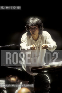 Florence, 1995. Japanese conductor Seiji Ozawa performing a rehearsal with Orchestra of the Florence May Festival / Firenze, 1995. Il direttore dorchestra Seiji Ozawa durante una prova con lorchestra del Maggio musicale fiorentino - ©Marcello Mencarini/Rosebud2