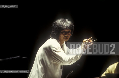 Florence, 1995. Japanese conductor Seiji Ozawa performing a rehearsal with Orchestra of the Florence May Festival / Firenze, 1995. Il direttore dorchestra Seiji Ozawa durante una prova con lorchestra del Maggio musicale fiorentino - ©Marcello Mencarini/Rosebud2