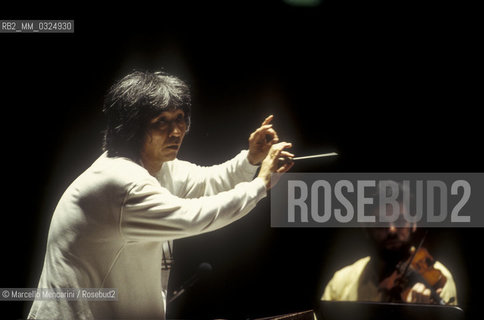 Florence, 1995. Japanese conductor Seiji Ozawa performing a rehearsal with Orchestra of the Florence May Festival / Firenze, 1995. Il direttore dorchestra Seiji Ozawa durante una prova con lorchestra del Maggio musicale fiorentino - ©Marcello Mencarini/Rosebud2