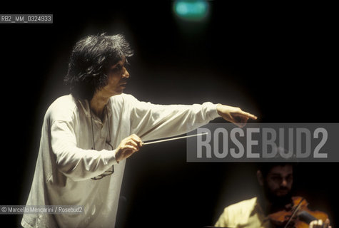 Florence, 1995. Japanese conductor Seiji Ozawa performing a rehearsal with Orchestra of the Florence May Festival / Firenze, 1995. Il direttore dorchestra Seiji Ozawa durante una prova con lorchestra del Maggio musicale fiorentino - ©Marcello Mencarini/Rosebud2