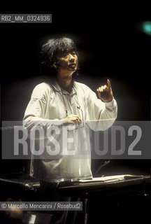 Florence, 1995. Japanese conductor Seiji Ozawa performing a rehearsal with Orchestra of the Florence May Festival / Firenze, 1995. Il direttore dorchestra Seiji Ozawa durante una prova con lorchestra del Maggio musicale fiorentino - ©Marcello Mencarini/Rosebud2