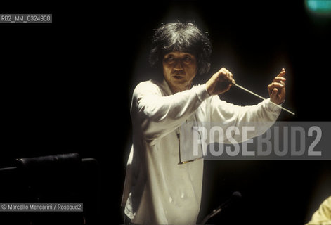 Florence, 1995. Japanese conductor Seiji Ozawa performing a rehearsal with Orchestra of the Florence May Festival / Firenze, 1995. Il direttore dorchestra Seiji Ozawa durante una prova con lorchestra del Maggio musicale fiorentino - ©Marcello Mencarini/Rosebud2