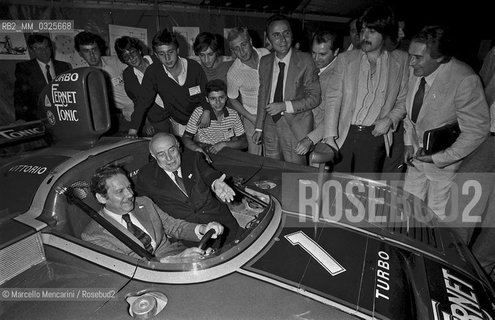 Modena, 1979. Politicians members of the Italian Christian Democracy Party Flaminio Piccoli and Amintore Fanfani in a rally car at the Festa dellAmicizia (Friendship Festival), the annual meeting of their party / Modena, 1979. I politici democristiani Flaminio Piccoli e Amintore Fanfani in un auto da rally alla Festa dellAmicizia, raduno annuale del loro partito - ©Marcello Mencarini/Rosebud2