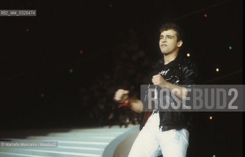 Sanremo Music Festival 1984. Italian pop singer Eros Ramazzotti performing Terra Promessa, winning song in the New Proposals category / Festival di Sanremo 1984. Eros Ramazzotti canta Terra promessa, canzone vincitrice della categoria Nuove proposte - ©Marcello Mencarini/Rosebud2