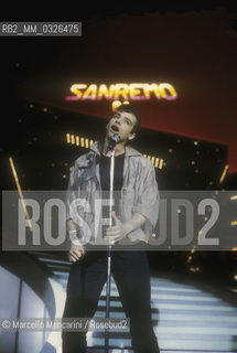 Sanremo Music Festival 1984. Italian pop singer Eros Ramazzotti performing Terra Promessa, winning song in the New Proposals category / Festival di Sanremo 1984. Eros Ramazzotti canta Terra promessa, canzone vincitrice della categoria Nuove proposte - ©Marcello Mencarini/Rosebud2