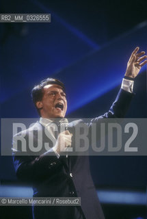 Sanremo Music Festival 1988. Italian pop singer Massimo Ranieri performing Perdere lAmore, winning song of the Festival / Festival di Sanremo 1988. Massimo Ranieri canta Perdere lamore, canzone vincitrice del Festival - ©Marcello Mencarini/Rosebud2