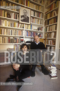 Rome, 1999. Italian journalist and TV writer Fabrizio Rondolino with his wife Simona Ercolani in their house. A portrait of Italian Communist leader Palmiro Togliatti is hanging on the bookcase / Roma, 1999. Fabrizio Rondolino, giornalista e autore televisivo, e sua moglie Simona Ercolani nella loro casa. Un ritratto del leader comunista Palmiro Togliatti è appeso nella loro libreria - ©Marcello Mencarini/Rosebud2