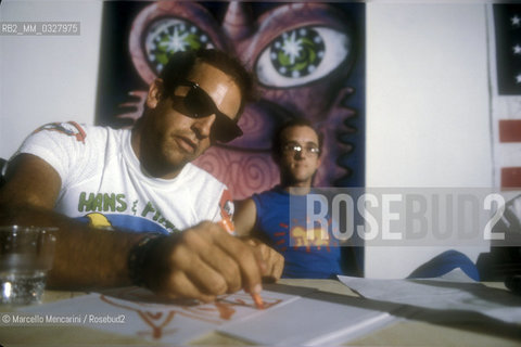 Milan, 1985. American artists Kenny Scharf and Keith Haring during a press conference after a performance at the Fiorucci store / Milano, 1985. Gli artisti Kenny Scharf e Keith Haring durante una conferenza stampa dopo una performance nel negozio Fiorucci - ©Marcello Mencarini/Rosebud2