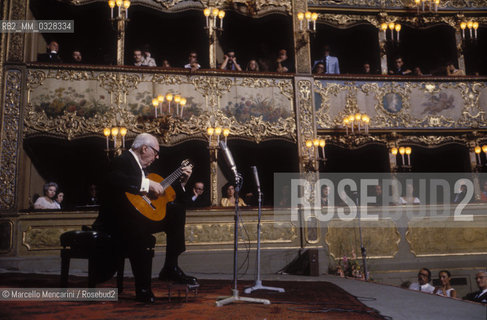 Venice, La Fenice Theater, 1980. Classical guitarist Andrés Segovia performing at his concert for receiving the A Life for Music award / Venezia, Teatro La Fenice, 1980. Il chitarrista classico Andrés Segovia durante il suo concerto in occasione del premio Una vita per la musica a lui attribuito - ©Marcello Mencarini/Rosebud2