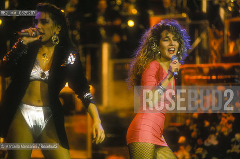 Sanremo Music festival 1991. Italian pop singers Sabrina Salerno and jo Squillo performing their song Siamo Donne / Festival di Sanremo 1991. Sabrina Salerno e Jo Squillo cantano Siamo donne - ©Marcello Mencarini/Rosebud2