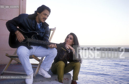 Sanremo Music Festival 1990. Brazilian singer-songwriter Toquinho and Italian singer Paola Turci, respectively performers of the song Nas asas de um violao and of its Italian version Ringrazio Dio / Festival di Sanremo 1990. Il cantautore brasiliano Toquinho e la cantante Paola Turci, interpreti rispettivamente della canzone Nas asas de um violao e della sua versione italiana Ringrazio Dio - ©Marcello Mencarini/Rosebud2