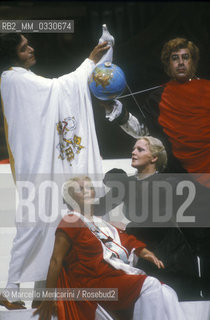 Pesaro, August 18, 1984. Rossini Opera Festival. Mezzo-soprano Lucia Valentini Terrani as Marchesa Melibea, soprano Katia Ricciarelli as Madame Cortese and basso buffo Enzo Dara as Baron Trombonok in Il viaggio a Reims (The Jorney to Reims) by Gioacchino Rossini. This is the first performance of that opera staged by Luca Ronconi and conducted by Claudio Abbado, after the reconstruction of its manuscript, assumed lost, in the 1970s / Pesaro, 18 agosto 1984. Rossini Opera Festival. Il mezzosoprano Lucia Valentini Terrani nel ruolo della Contessa Melibea, Il soprano Katia Ricciarelli nel ruolo di Madame Cortese e il basso buffo Enzo Dara nel ruolo del Barone di Trombonok ne Il viaggio a Reims di Gioacchino Rossini. E la prima rappresentazione dellopera con la regia di Luca Ronconi e la direzione dorchestra di Clauio Abbado, dopo il ritrovamento e la ricomposizione negli anni 70 del suo manoscritto che si credeva perduto - ©Marcello Mencarini/Rosebud2