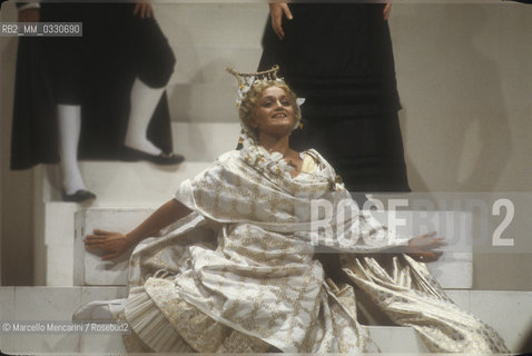 Pesaro, August 18, 1984. Rossini Opera Festiva. Soprano Cecilia Gasdia as Corinna in Il viaggio a Reims (The Jorney to Reims) by Gioacchino Rossini. This is the first performance of that opera, staged by Luca Ronconi and conducted by Claudio Abbado, after the reconstruction of its manuscript, assumed lost, in the 1970s / Pesaro, 18 agosto 1984. Rossini Opera Festival. Il soprano Cecilia Gasdia nel ruolo di Corinna in Il viaggio a Reims di Gioacchino Rossini. E la prima rappresentazione dellopera, con la regia di Luca Ronconi e la direzione dorchestra di Claudio Abbado, dopo il ritrovamento e la ricomposizione negli anni 70 del suo manoscritto che si credeva perduto - ©Marcello Mencarini/Rosebud2