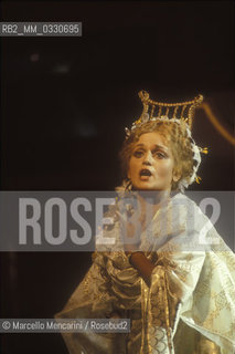 Pesaro, August 18, 1984. Rossini Opera Festiva. Soprano Cecilia Gasdia as Corinna in Il viaggio a Reims (The Jorney to Reims) by Gioacchino Rossini. This is the first performance of that opera, staged by Luca Ronconi and conducted by Claudio Abbado, after the reconstruction of its manuscript, assumed lost, in the 1970s / Pesaro, 18 agosto 1984. Rossini Opera Festival. Il soprano Cecilia Gasdia nel ruolo di Corinna in Il viaggio a Reims di Gioacchino Rossini. E la prima rappresentazione dellopera, con la regia di Luca Ronconi e la direzione dorchestra di Claudio Abbado, dopo il ritrovamento e la ricomposizione negli anni 70 del suo manoscritto che si credeva perduto - ©Marcello Mencarini/Rosebud2