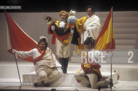 Milan, La Scala Theater, 1985. Tenor Chris Merritt as Count Libenskof, basso buffo Enzo Dara as Baron Trombonok and bass-baritone Ruggero Raimondi as Don Profondo in Il viaggio a Reims (The Jorney to Reims) by Gioacchino Rossini, staged by Luca Ronconi and directed by Claudio Abbado / Milano, Teatro alla Scala, 1985. Il tenore Chris Merritt nel ruolo del Conte Libenskof, il basso buffo Enzo Dara nel ruolo del Barone Trombonok e il basso baritono Ruggero Raimondi nel ruolo di Don Profondo ne Il viaggio a Reims di Gioacchino Rossini, con la regia di Luca Ronconi e la direzione dorchestra di Claudio Abbado - ©Marcello Mencarini/Rosebud2