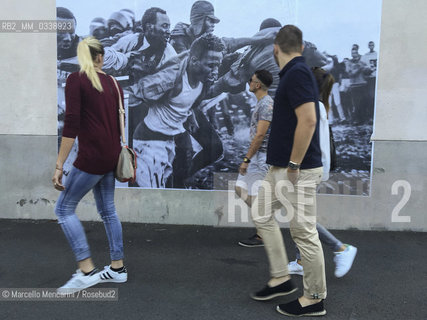 Perpignan, France, 2015. Visa pour limage, International Festival of Photojournalism: #disturb, photo by Gianfranco Tripodo - about Subsaharan migrants escaping from the police in Melilla, Spain (April 24, 2014 ) - pasted on a wall near the Couvent of Minimes / Perpignan, Francia, 2015. Visa pour limage, Festival internazionale del fotogiornalismo: #disturb, foto di Gianfranco Tripodo - sui migranti subsahariani che scappano dalla polizia a Melilla, in Spagna (aprile 2014) - incollata su un muro vicino al Couvent des Minimes - ©Marcello Mencarini/Rosebud2