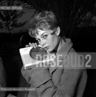 Rome, 1960. French actress Brigitte Bardot in her Roman house holding a radio / Roma, 1960. Lattrice francese Brigitte Bardot nella sua casa romana con in mano una radio - ©Marcello Mencarini/Rosebud2