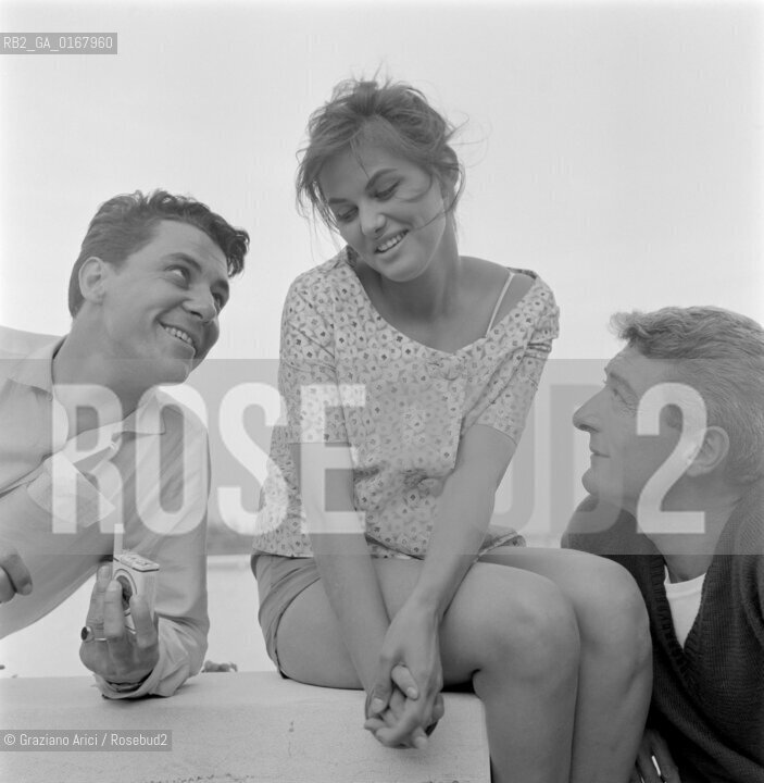 THE ACTRESS CLAUDIA CARDINALE   WITH THE ACTORS PHILIPPE NICAUD AND ANDRE VERSINI AT INTERNATIONAL FILM FESTIVAL  IN VENICE - 1958 - © ARCHIVIO Graziano Arici/Rosebud2  / ATTRICE / MOSTRA DEL CINEMA