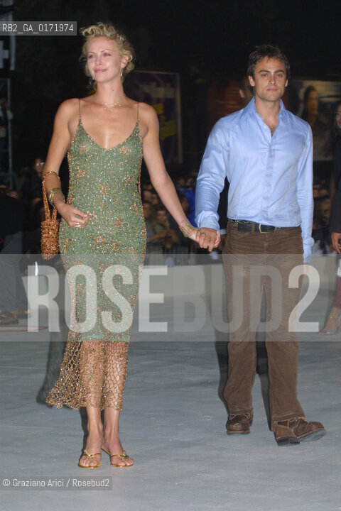 01/09 - VENICE - 58.INTERNATIONAL FILM FESTIVAL - THE ACTRESS  CHARLIZE THERON WITH HER BOYFRIEND  THE CURSE OF THE JADE SCORPION - ©Graziano Arici/Rosebud2