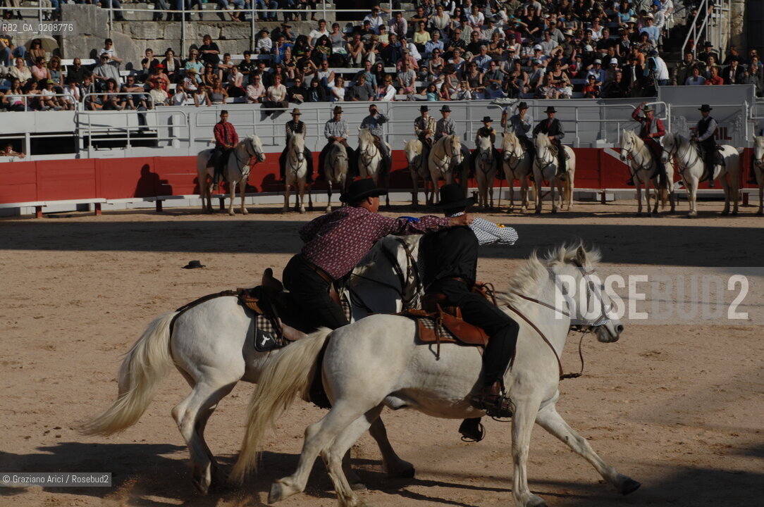 ARLES (FRANCE, PROVENCE) 1 MAY 2008 - 1 MAY HOLIDAY - FETE DES GARDIANS - HOLIDAY OF THE CAMARGUE CATTLE FARMER AND ELECTION OF ARLES QUEEN ROMAN ARENA ©Graziano Arici/Rosebud2 CAVALLO FESTA DEI GARDIANS COSTUME MAGGIO GIOIELLO PROVENZA CAPPELLO BAMBINO COURSE CAMARGUESE TORO GEO