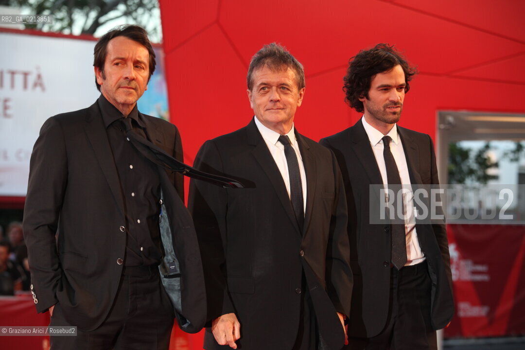 Italy, Venice - September 05th, 2009.66th VENICE INTERNATIONAL FILM FESTIVAL - FILM: PERSÉCUTION. THE DIRECTOR PATRICE CHÉREAU (CENTER) WITH THE ACTORS ROMAIN DURIS (RIGHT) AND JEAN-HUGUES ANGLADE  AT THE RED CARPET