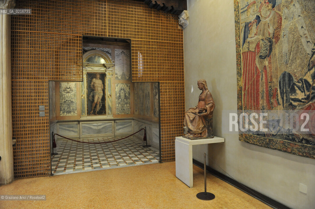 Venice - 12/7/10 - Cà dOro Museum : Wooden grate in front of  St. Sebastian by Andrea Mantegna. The wooden grate was put by an architect follower of Carlo Scarpa. Museo grata sebastiano ©Graziano Arici/Rosebud2