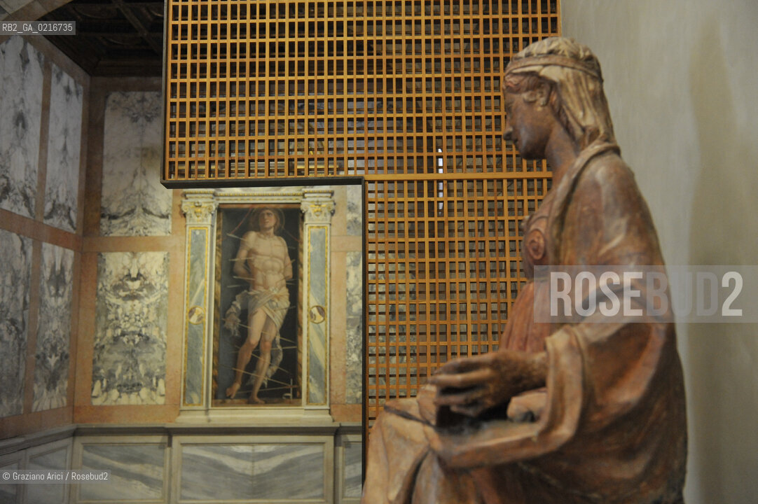 Venice - 12/7/10 - Cà dOro Museum : Wooden grate in front of  St. Sebastian by Andrea Mantegna. The wooden grate was put by an architect follower of Carlo Scarpa. Museo grata sebastiano ©Graziano Arici/Rosebud2